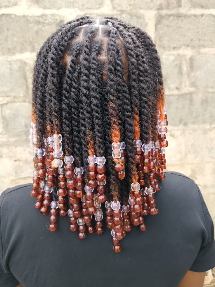 someone with twists with beads