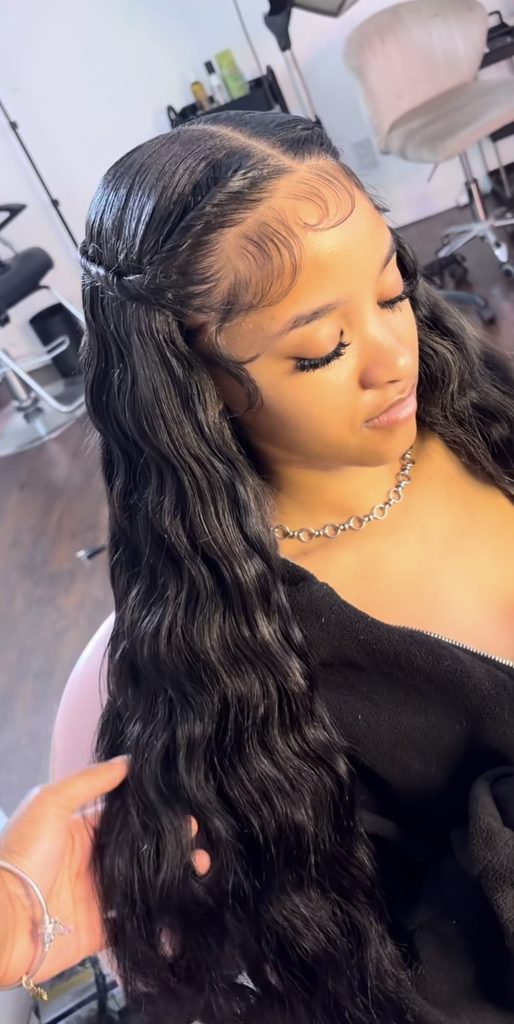 someone with wig install over braided base