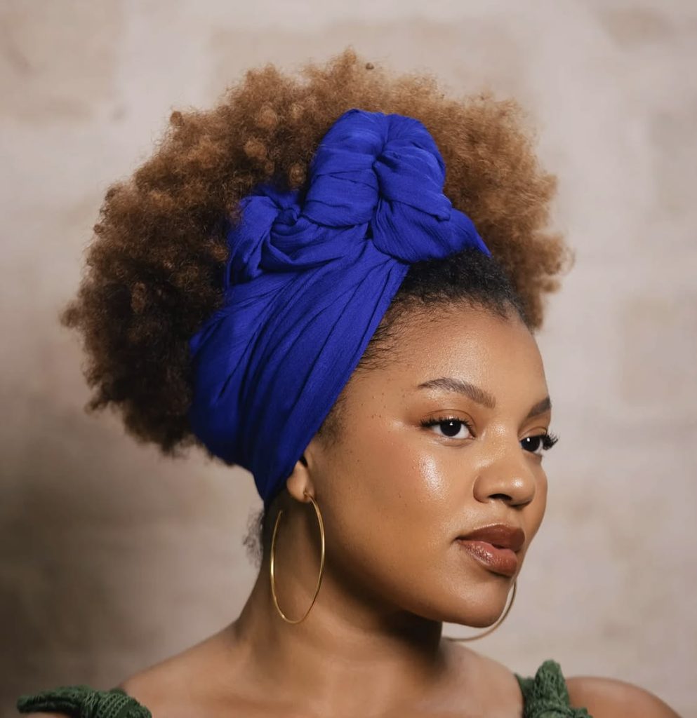 someone with wrap in bold solid color