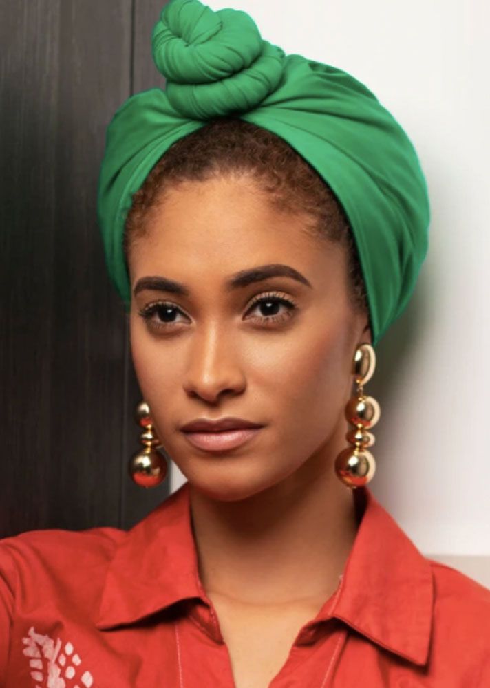 someone with wrap with knot in front as one of the cute headwrap styles for bad hair days