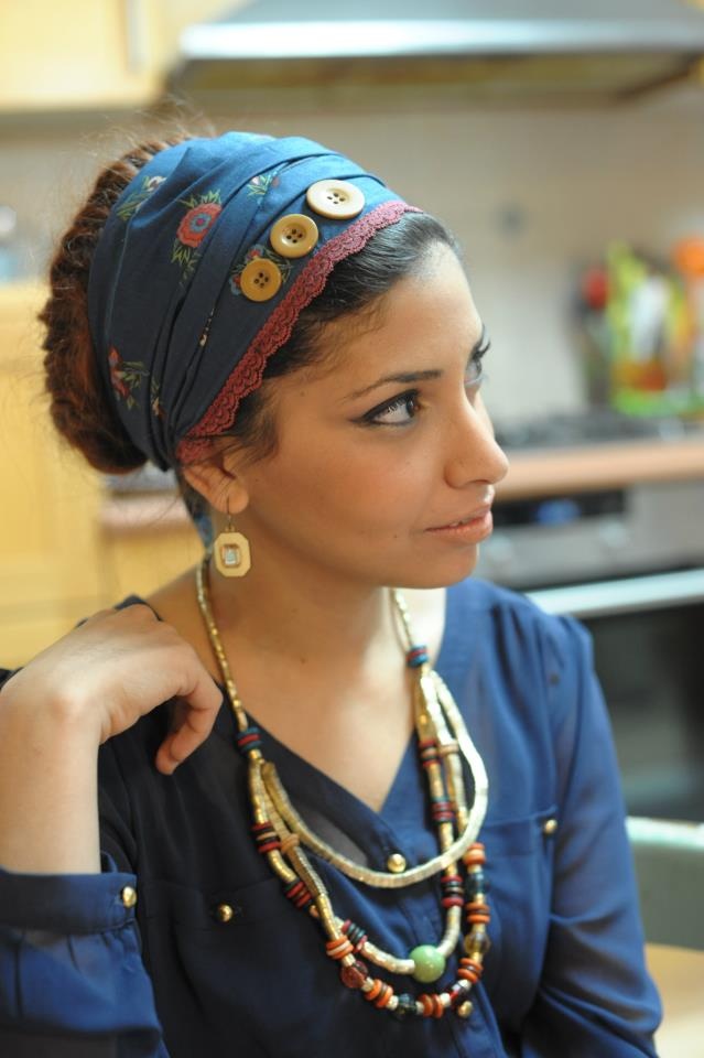someone with wrap with layered necklace