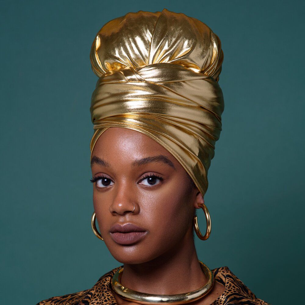 someone with wrap with metallic fabric