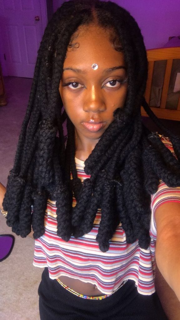 someone with yarn braids