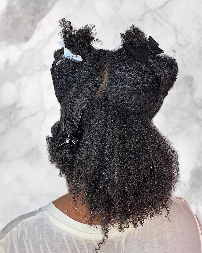 someone that sectioned her hair as part of healthy hair routine ideas