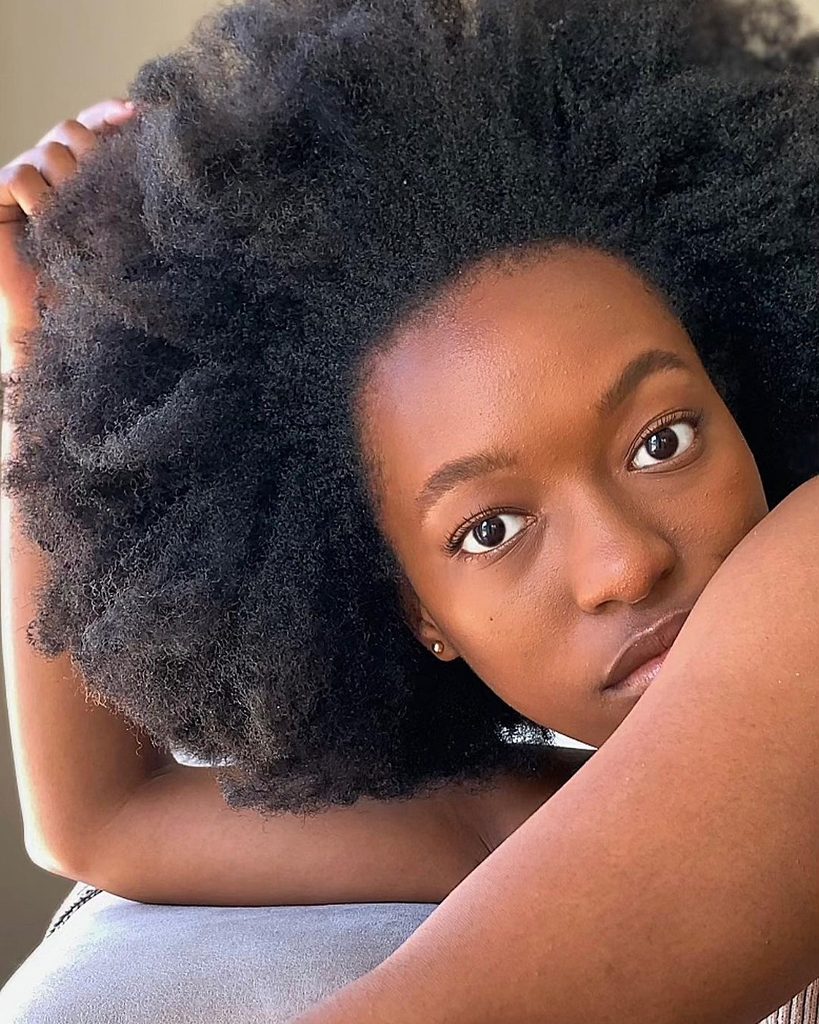 someone with a grown afro hair