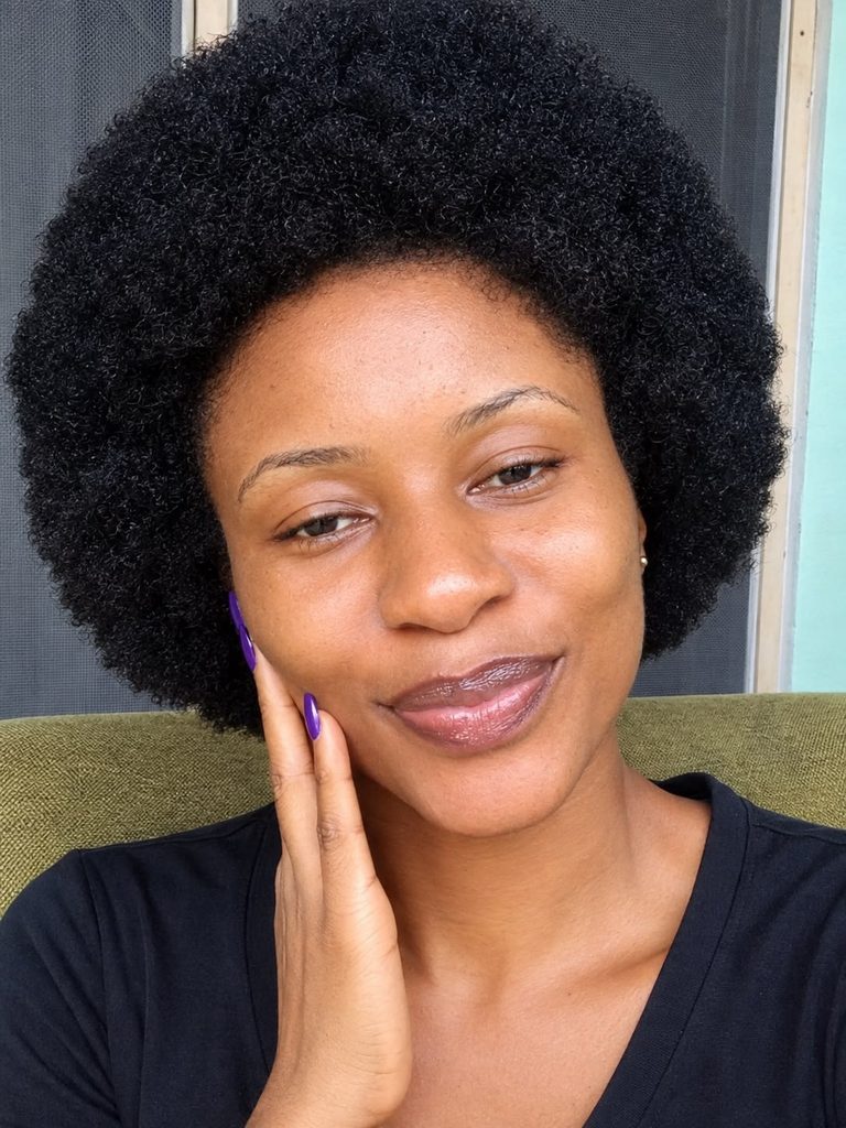 someone with afro hair in her afro hair journey