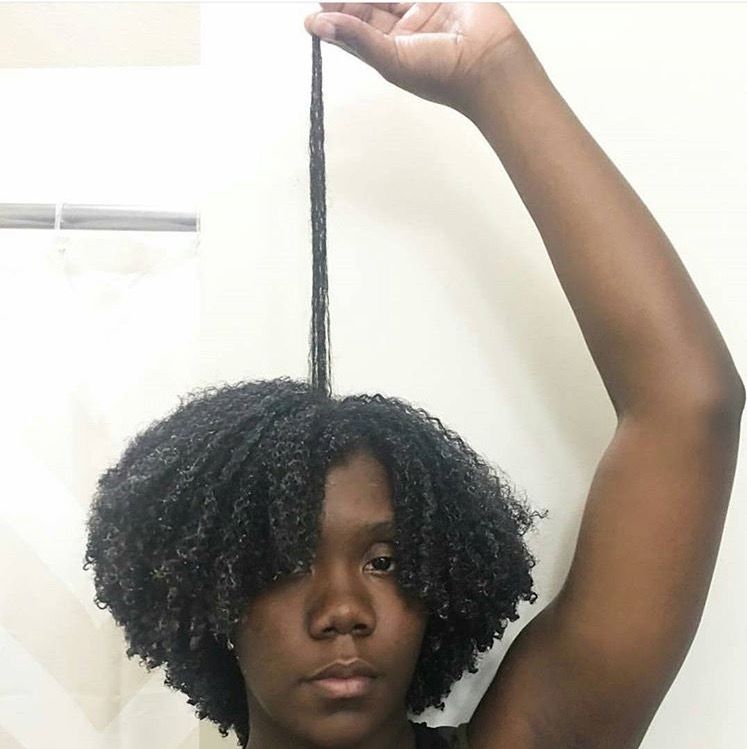 someone with elastic curly afro hair
