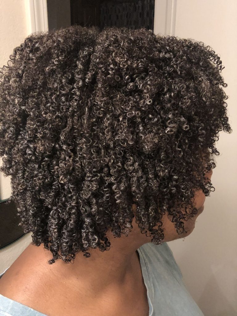 someone with curly hair