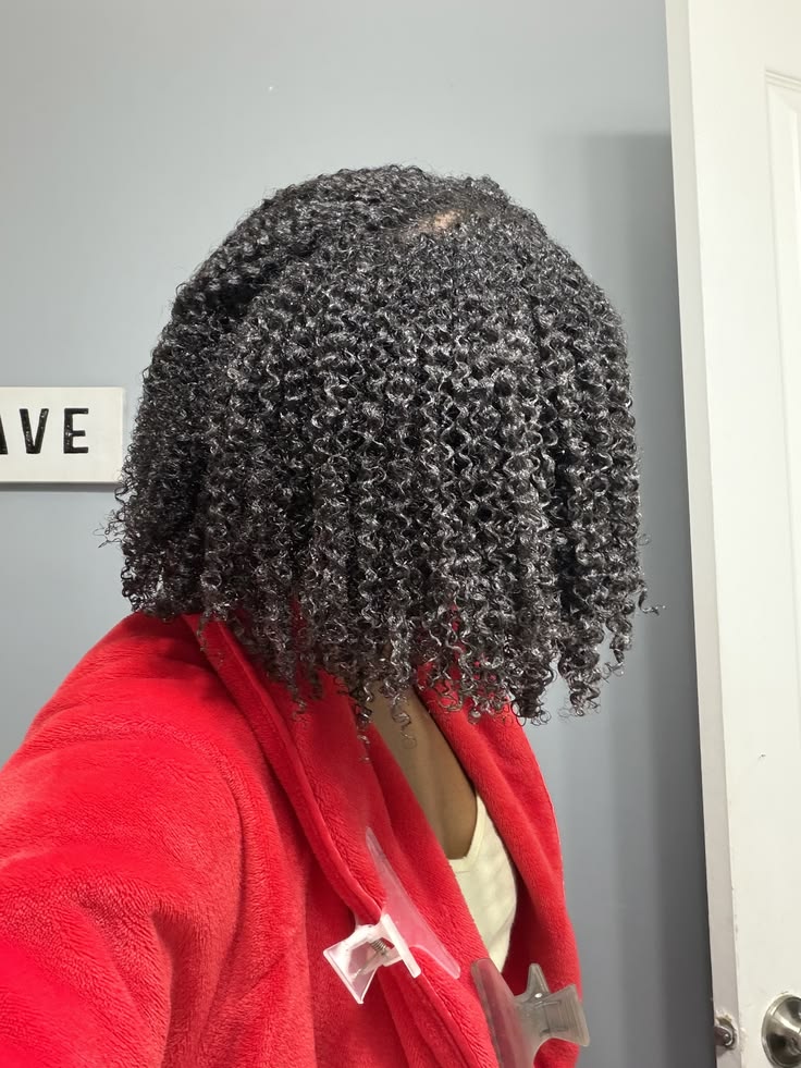 someone with curl hair with mask
