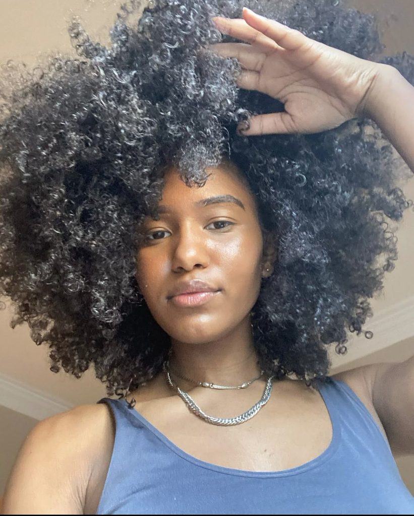 someone with afro natural hair