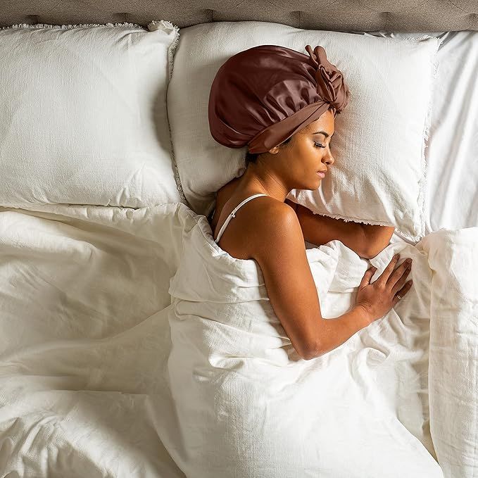 someone sleeping with hair bonnet