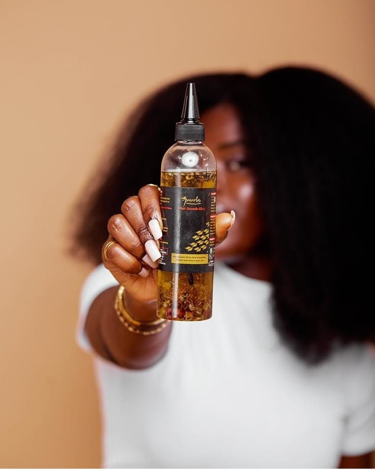 someone with hair oil