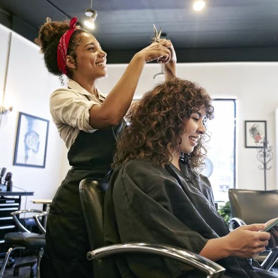 someone getting her hair styled