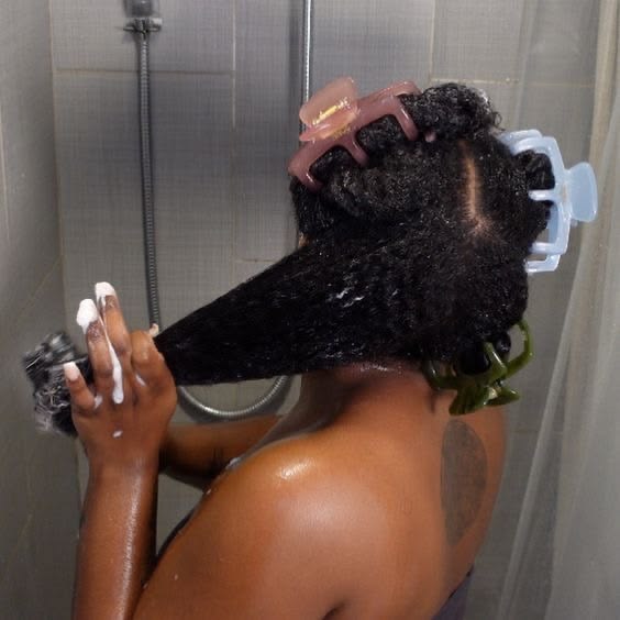 someone washing her hair