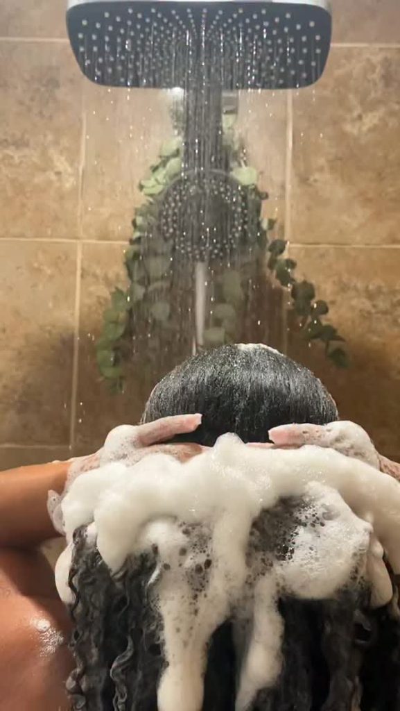 someone washing her hair
