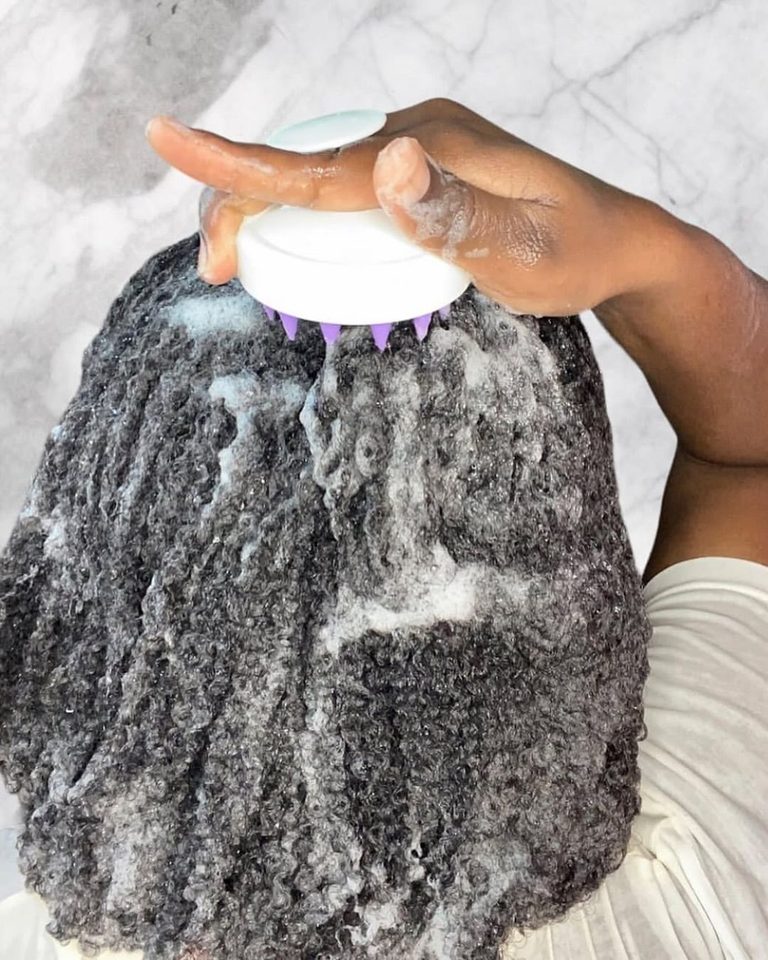 someone washing hair and massaging scalp