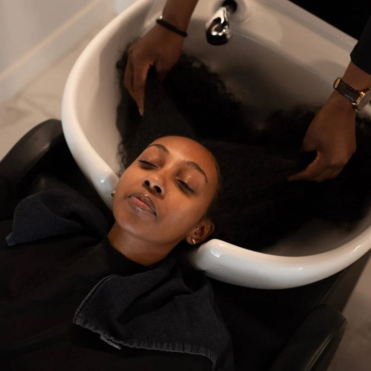 someone getting her hair washed