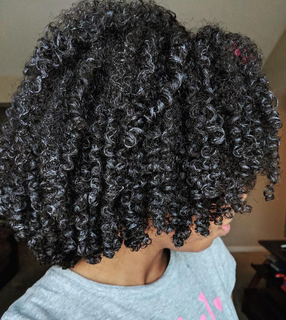 someone with hair with gel cast as how to protect afro hair from humidity
