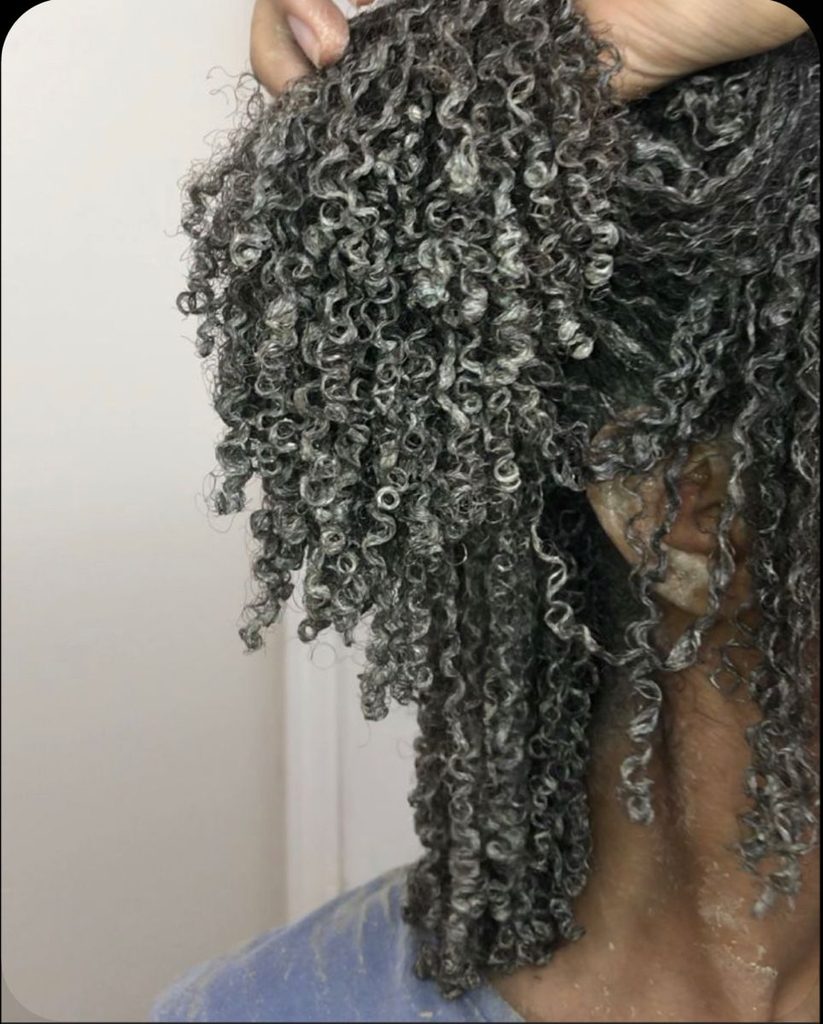 someone with hair that has hair products in it