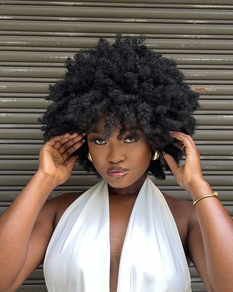 someone with medium-length afro hair