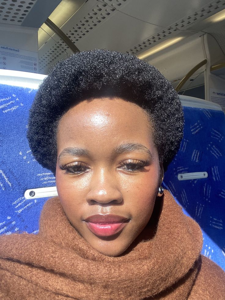 someone with short afro her growth