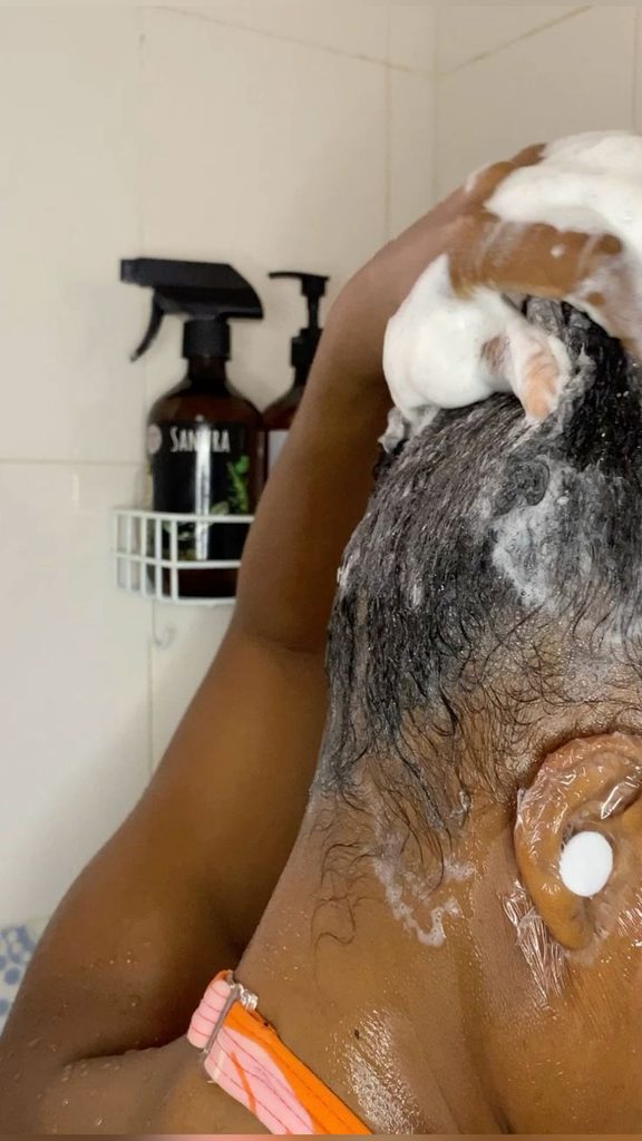 someone washing her hair