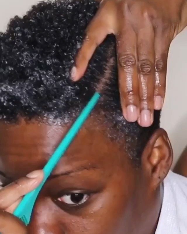 someone styling her short hair