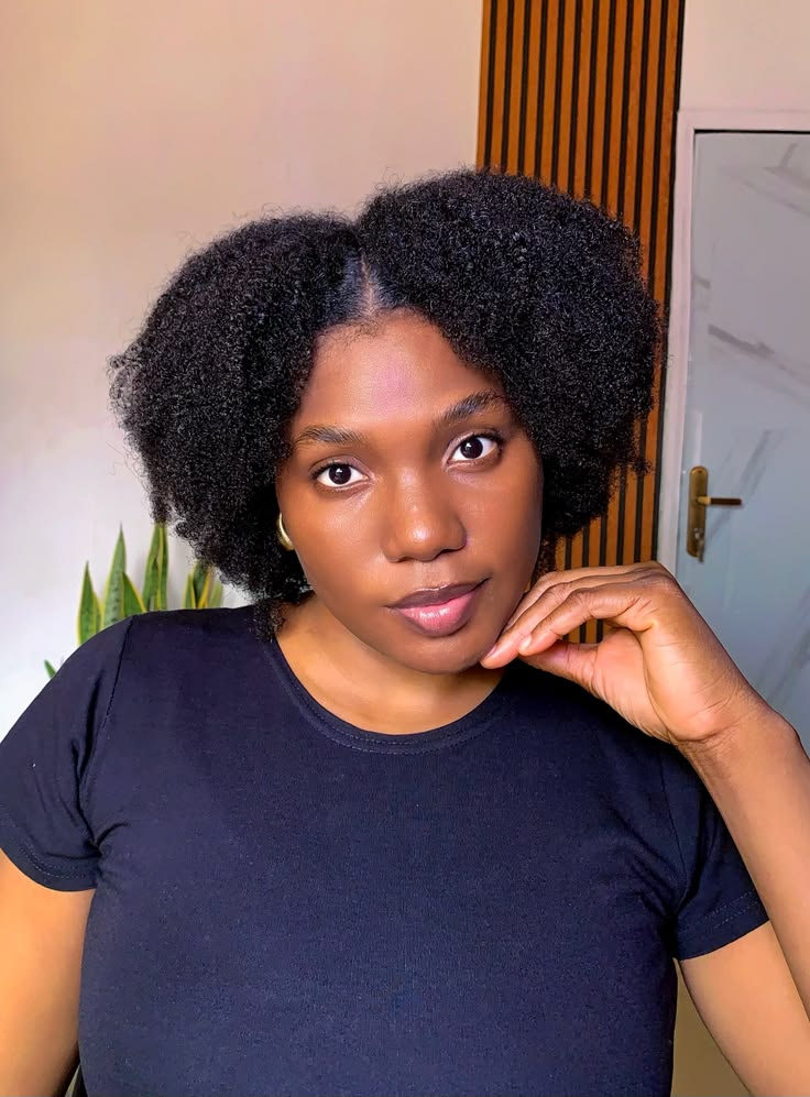 someone with center part afro