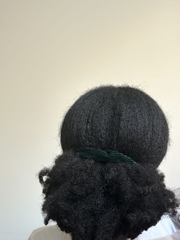 someone with afro low puff