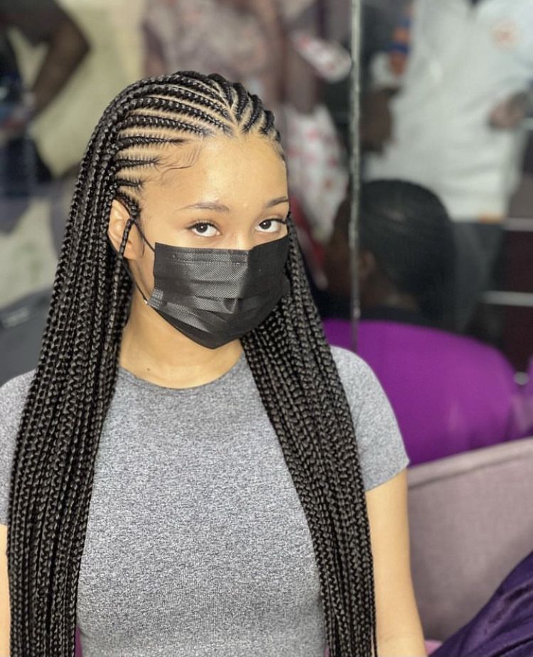 someone with tribal braid afro hairstyles