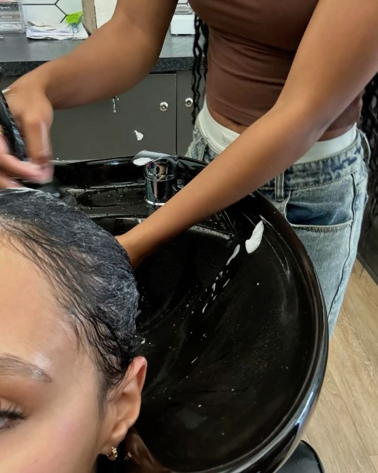 someone washing her hair